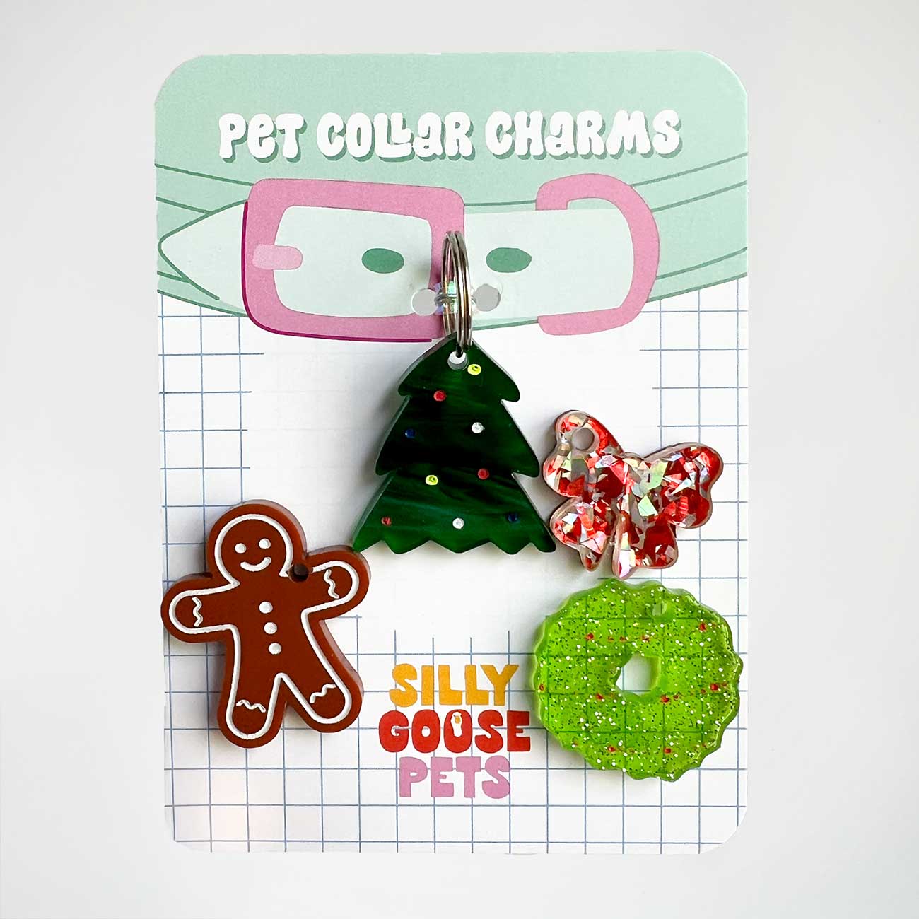 Pet collar charms on a card with 'Silly Goose Pets' branding