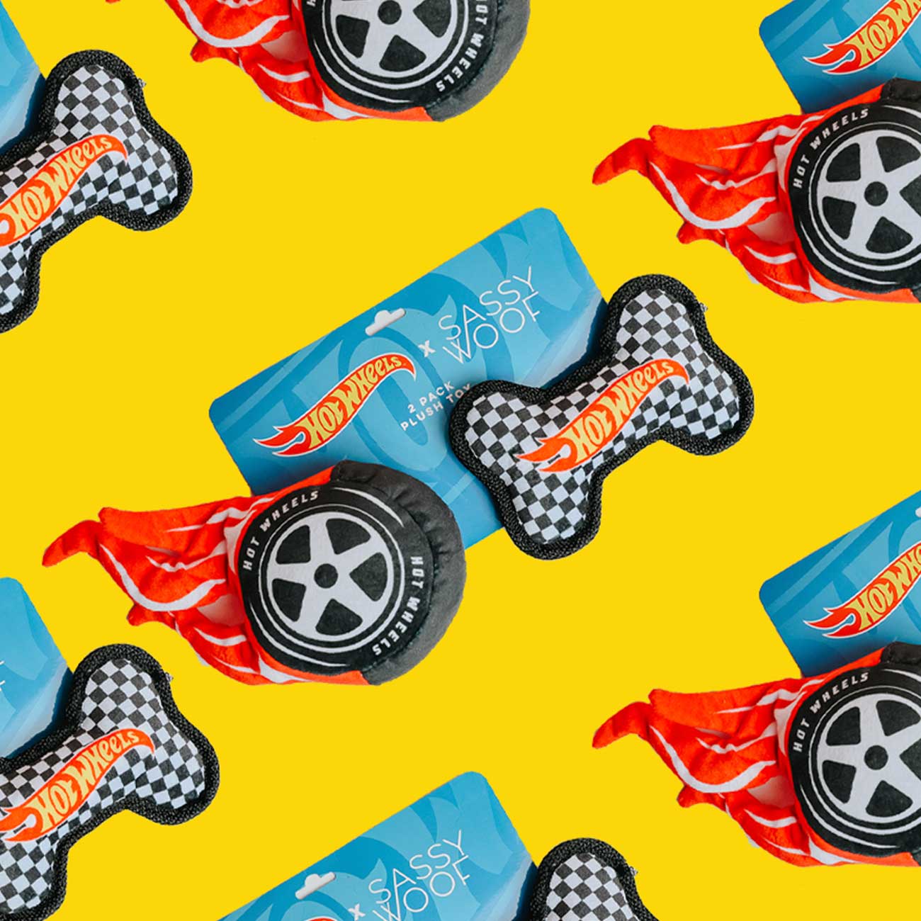 Pattern of Hot Wheels-themed dog toys on a yellow background