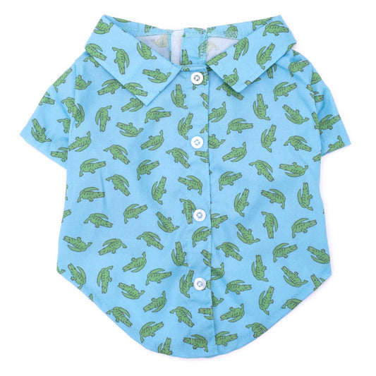 Blue shirt with green crocodile pattern on a white background