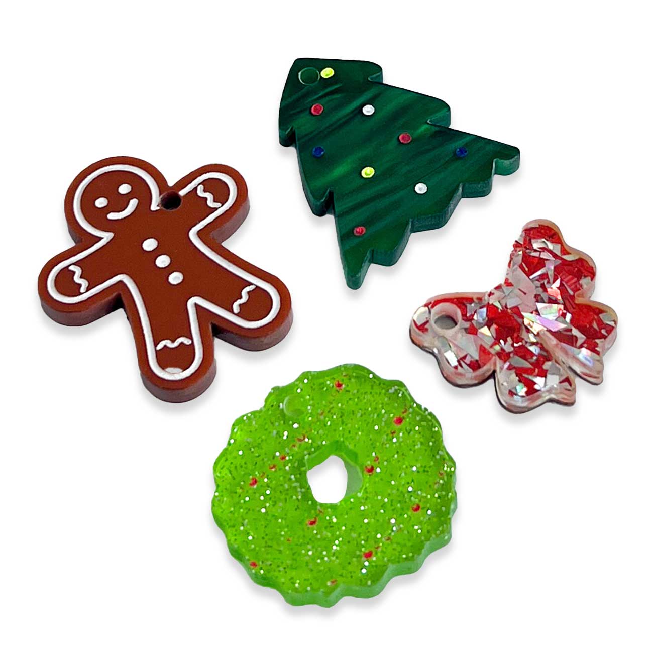 Four Christmas-themed dog toys on a white background