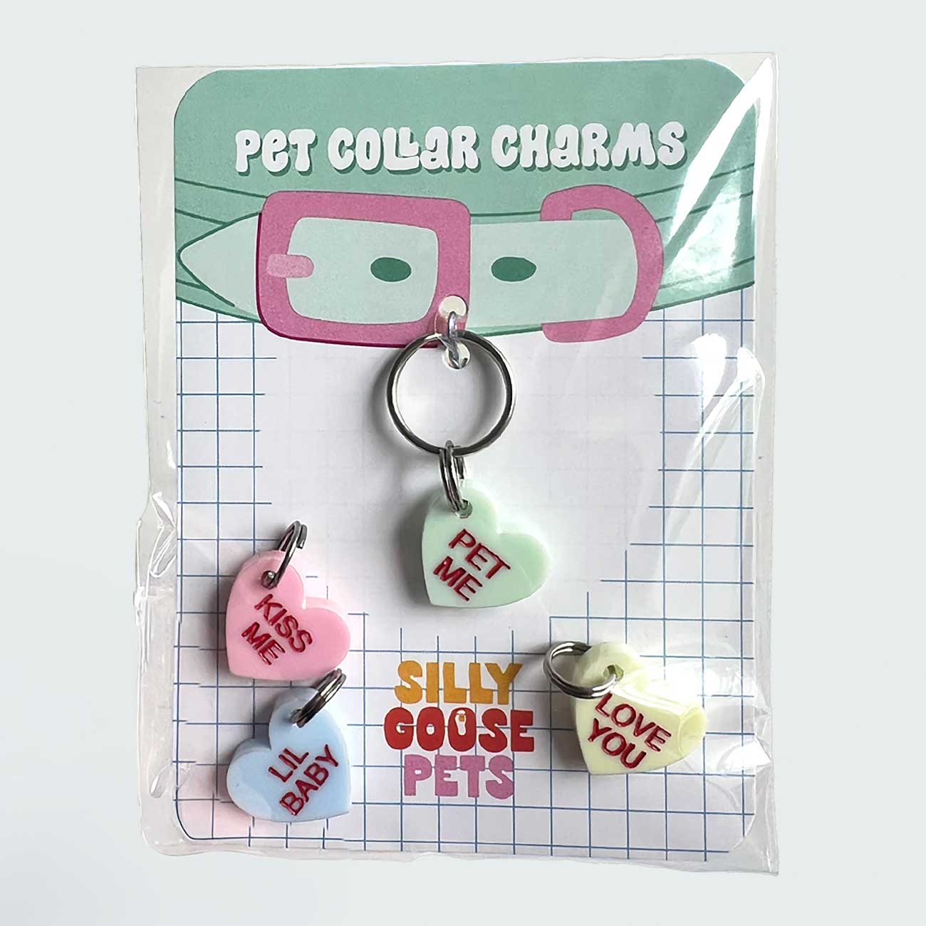 Pet collar charms in packaging with 'Silly Goose Pets' branding