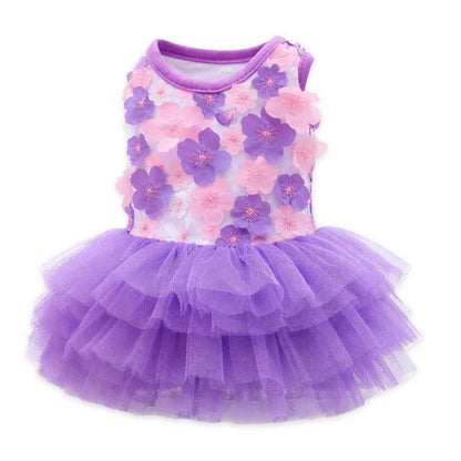 Purple pet dress with floral pattern on a white background