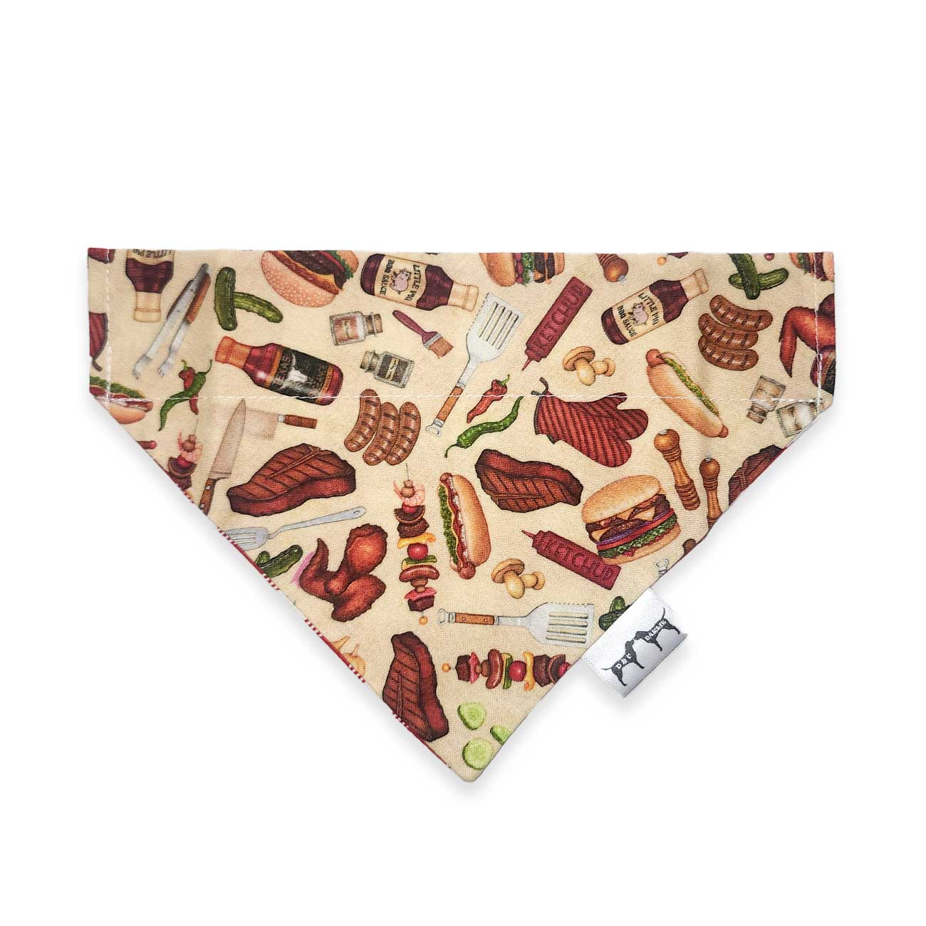 Dog bandana with barbecue-themed design on a beige background
