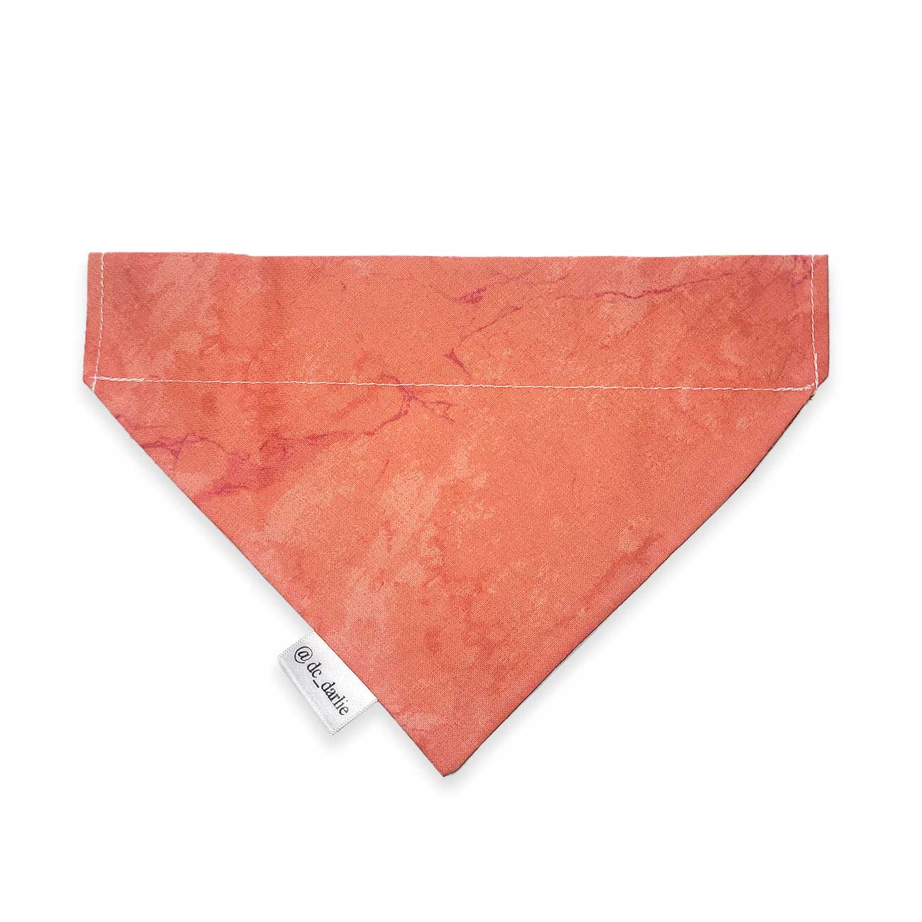 Dog bandana with a brand tag on a white background