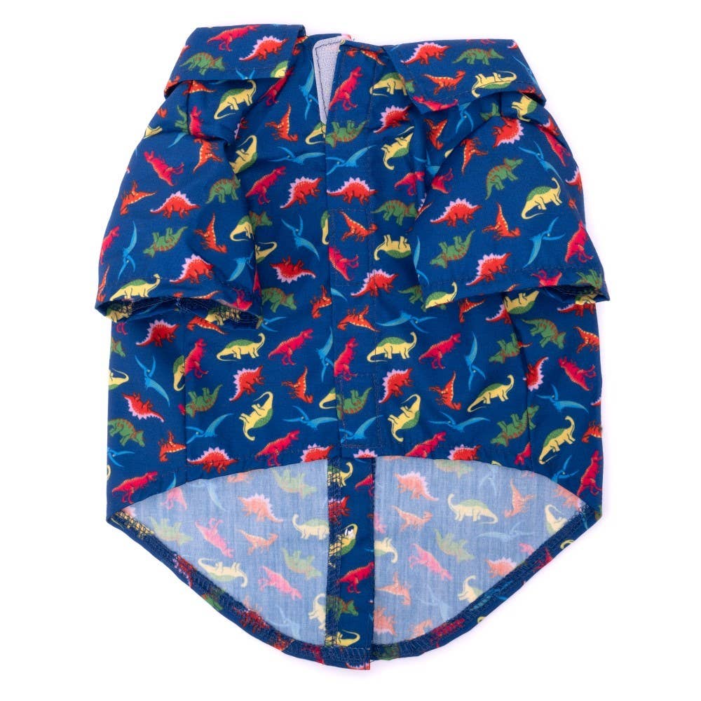 Dog shirt with colorful dinosaur pattern on a blue background