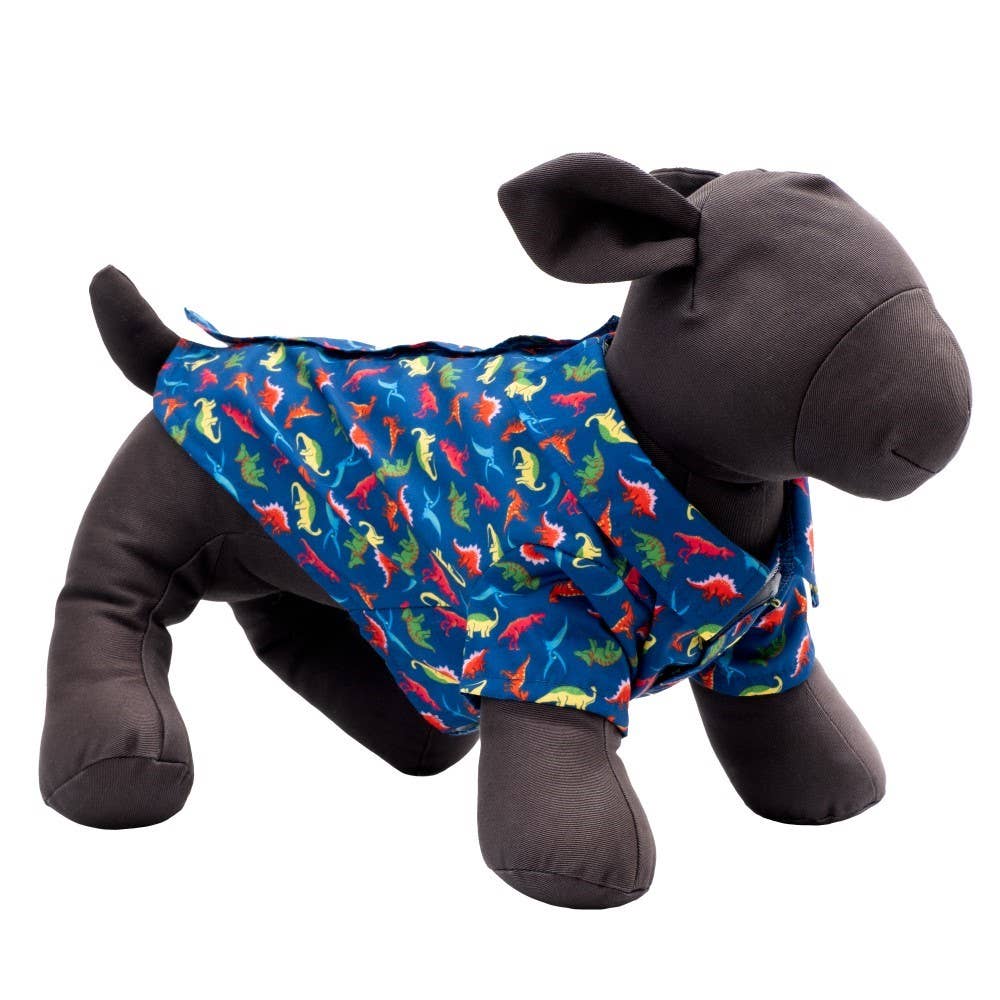 Stuffed animal wearing a blue dog shirt with colorful dinosaur pattern on a white background