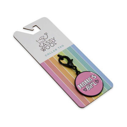 Collar tag with 'Mama's Girl' on a colorful Sassy Woof packaging