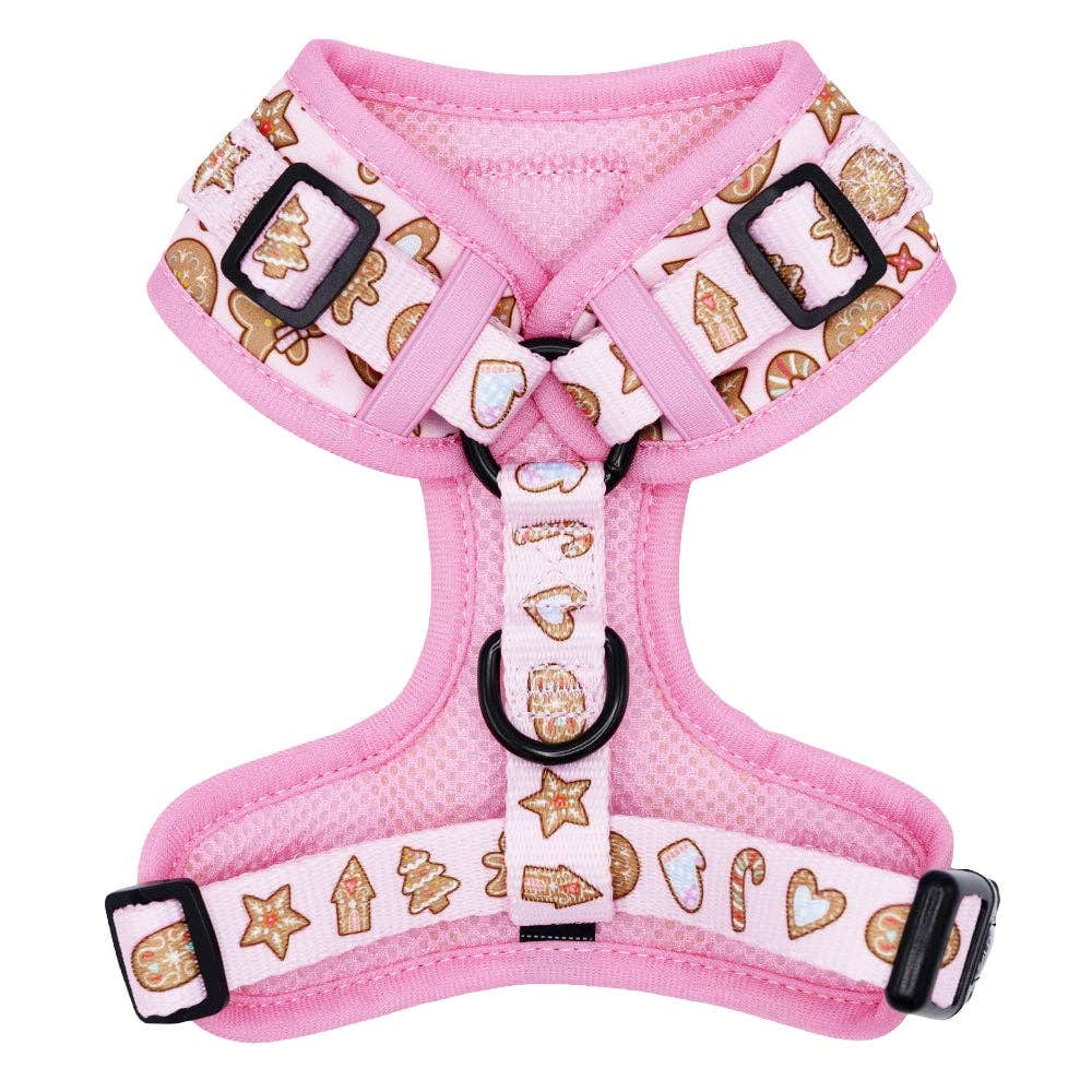 Pink dog harness with gingerbread pattern on a white background