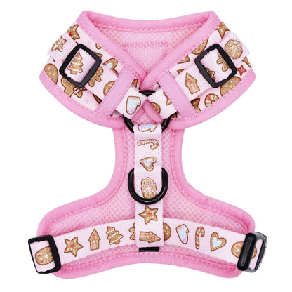 Pink dog harness with gingerbread pattern on a white background