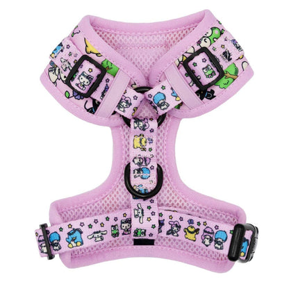 Pink dog harness with cartoon character pattern on a white background