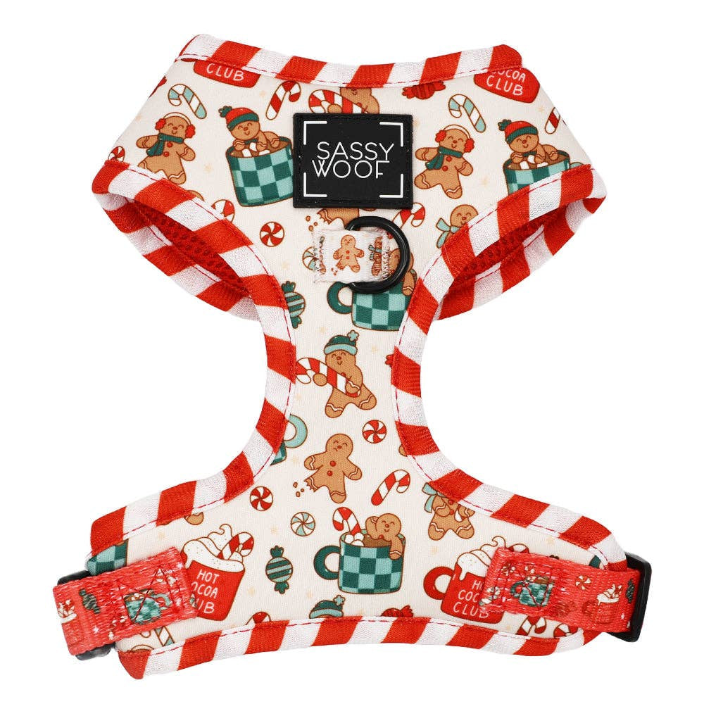 Dog harness with Christmas-themed design featuring gingerbread men and candy canes on a white background.
