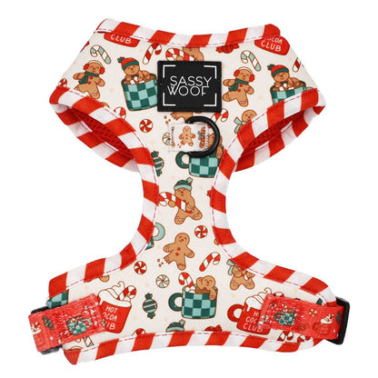Dog harness with Christmas-themed design featuring gingerbread men and candy canes on a white background.