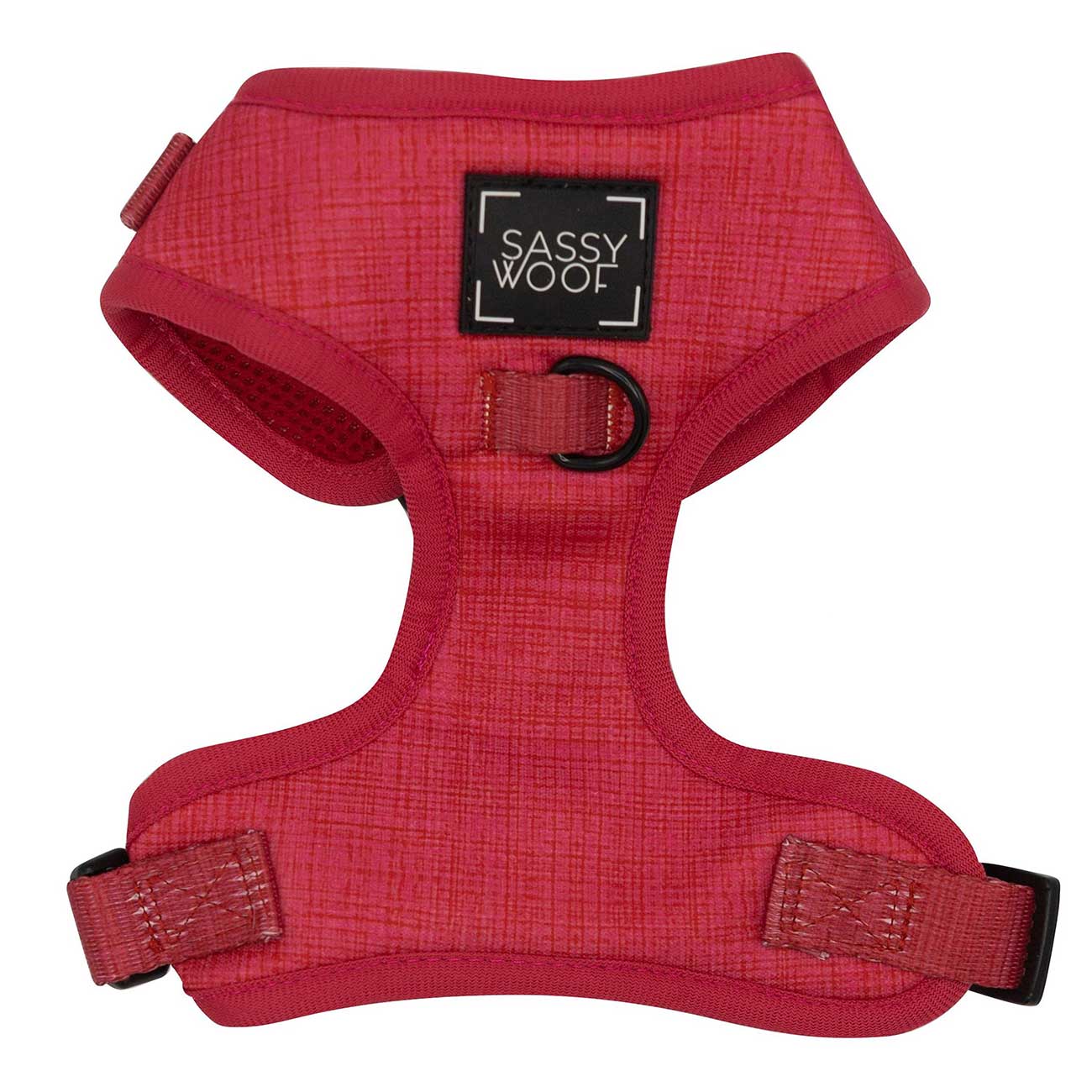 Red dog harness with 'Sassy Woof' label on a white background