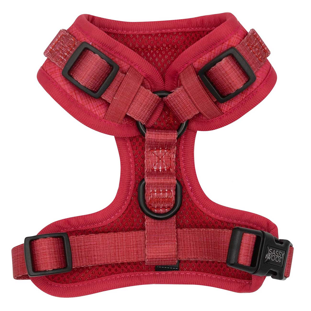 Red dog harness with black buckles on a white background