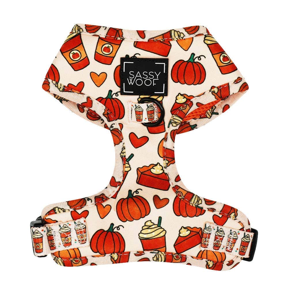 Dog harness with Halloween-themed design featuring pumpkins, ghosts, and candy corn on a white background.