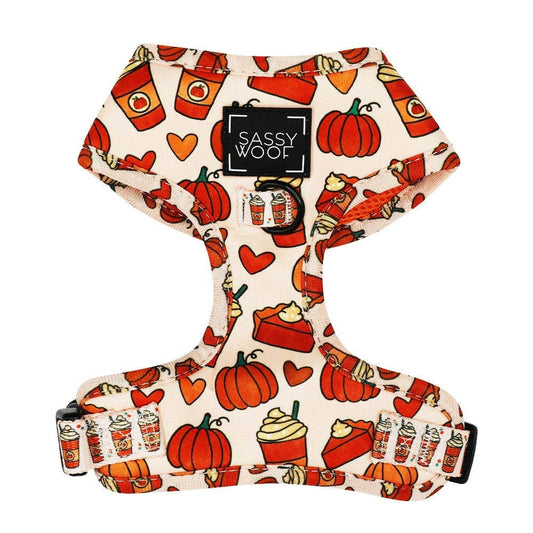 Dog harness with Halloween-themed design featuring pumpkins, ghosts, and candy corn on a white background.