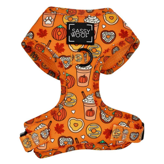 Orange dog harness with autumn-themed design on a white background