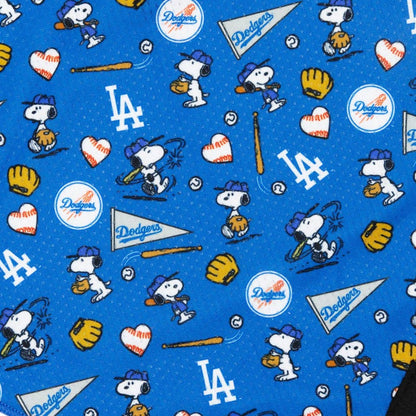 Pattern of Snoopy playing baseball with Los Angeles Dodgers logos on a blue background