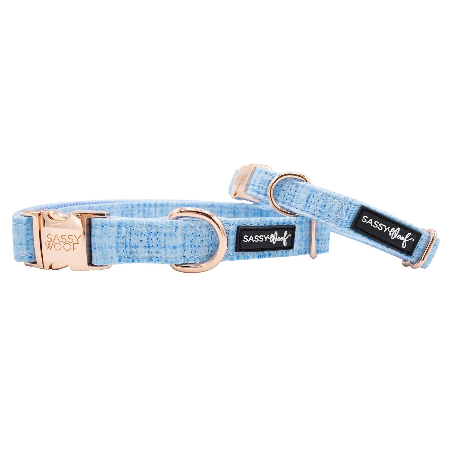 Dog collar with rose gold hardware and blue fabric on a white background