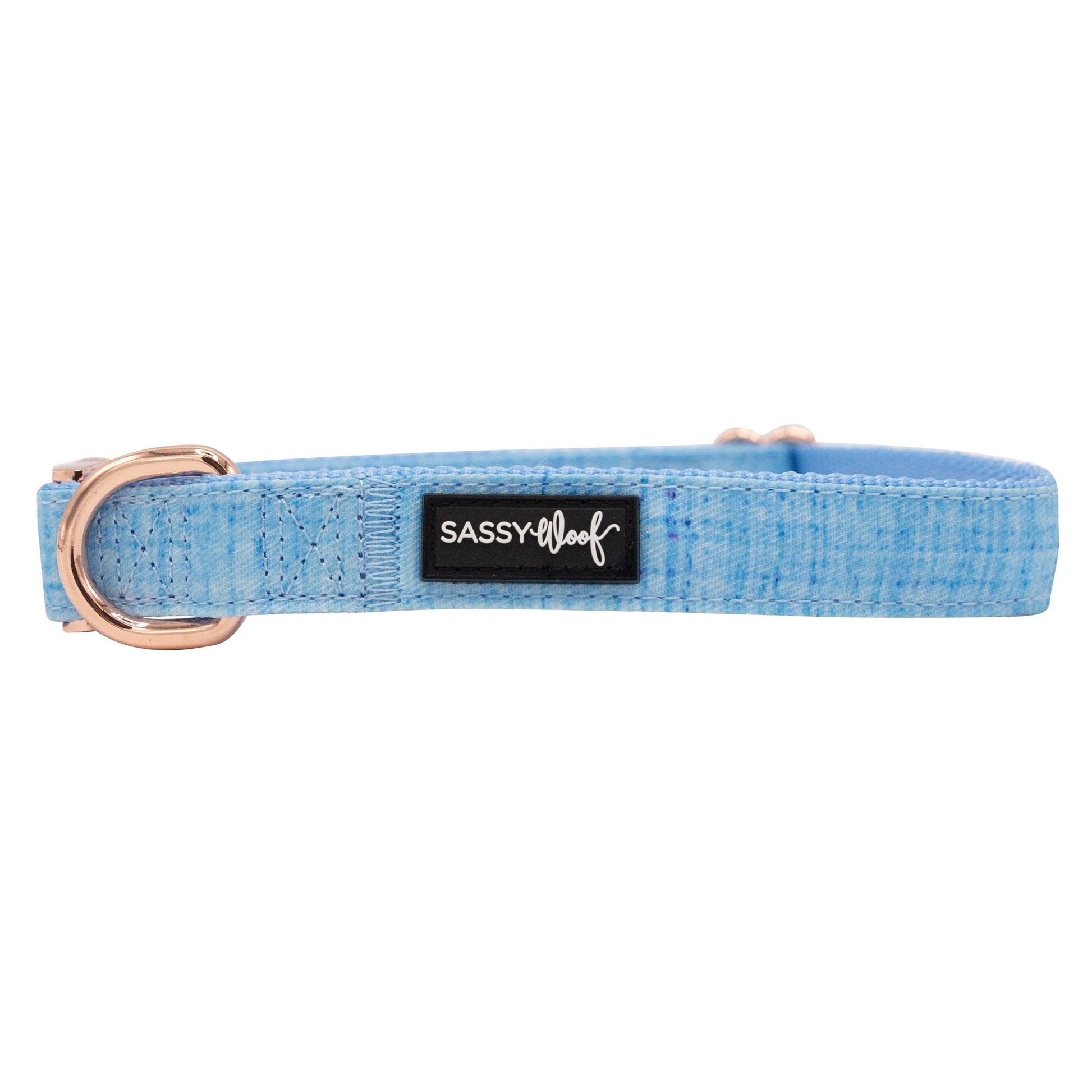 Blue dog collar with a rose gold ring and 'Sassy & Lula' label on a white background