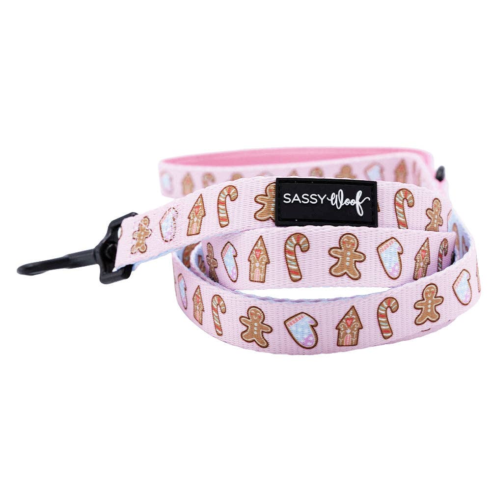 Dog leash with gingerbread design and 'Sassy Leash' label on a white background