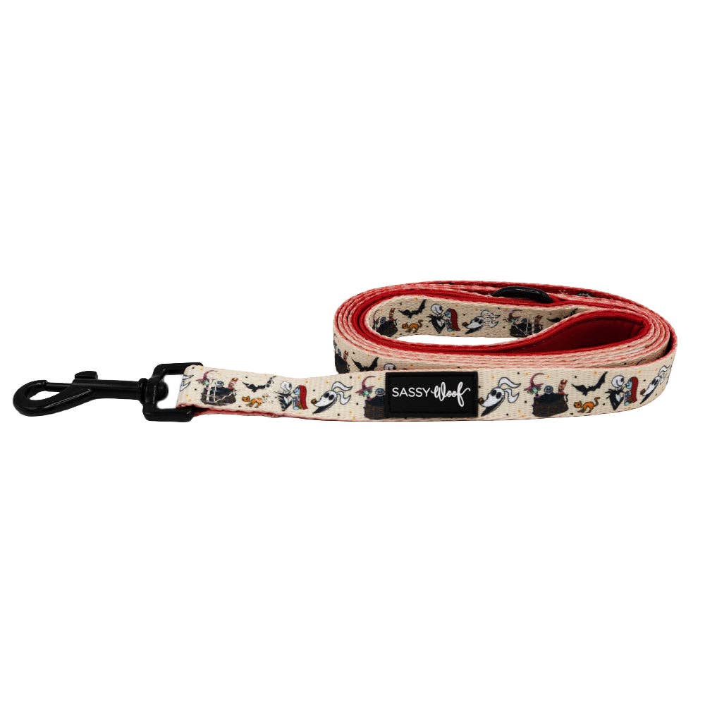 Dog leash with cartoon dog design and 'Sassy Woof' branding on a white background