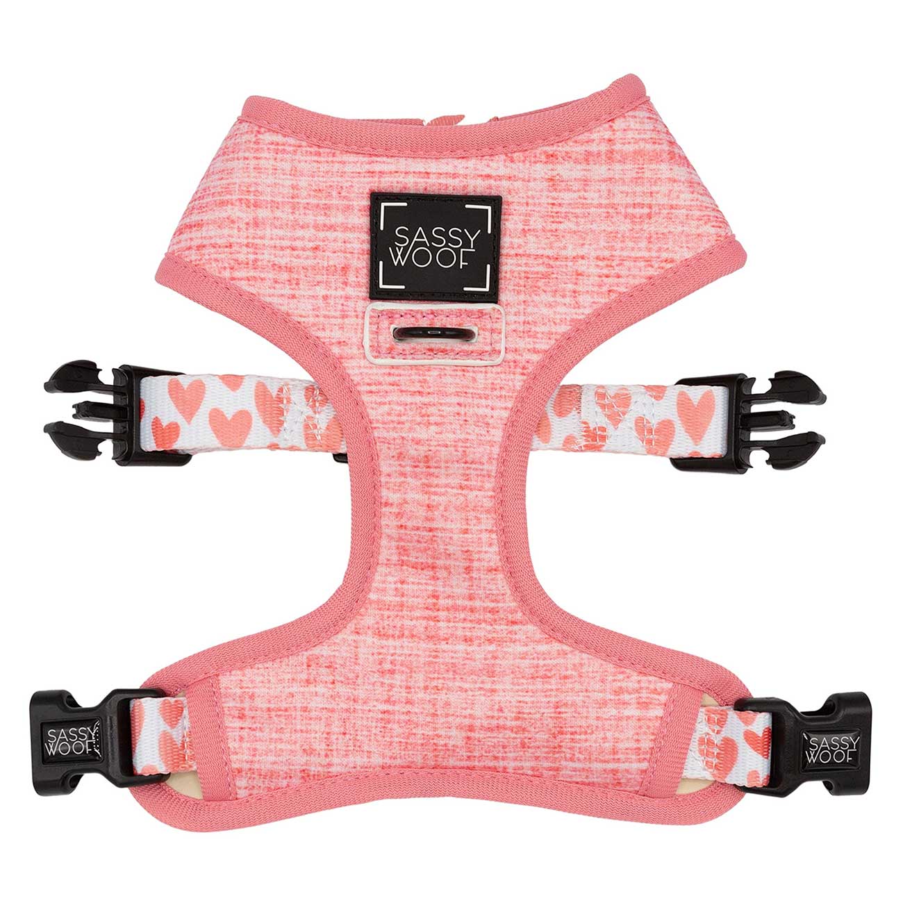 Pink dog harness with floral patterned straps on a white background, branded 'Sassy Woof'.