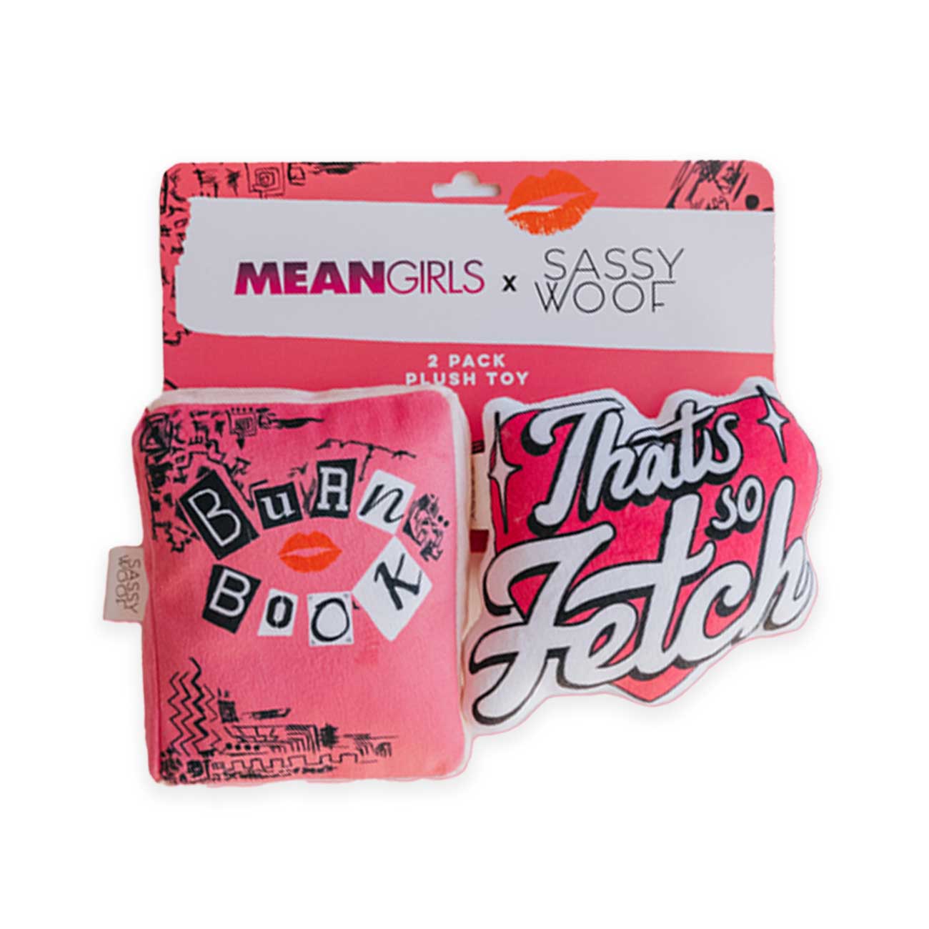 Two pink plush toys with 'Mean Girls' text in packaging on a white background
