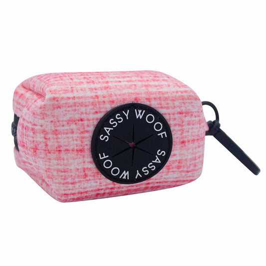 Pink textured pouch with 'Sassy Woof' branding on a white background