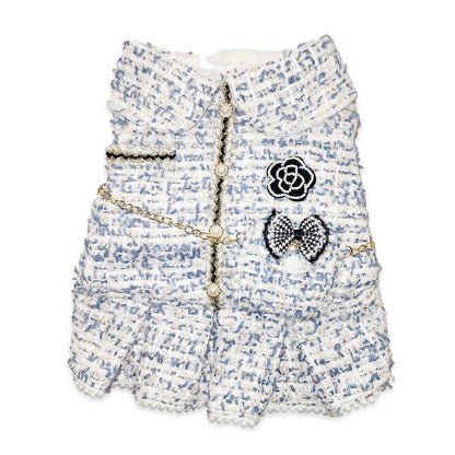Floral patterned dog dress with decorative elements on a white background