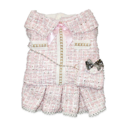 Pink textured dress with decorative elements on a white background
