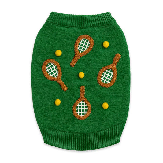 Green dog sweater with tennis racket and ball designs on a white background