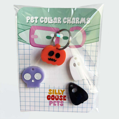 Pet collar charms in packaging with 'Silly Goose Pets' branding