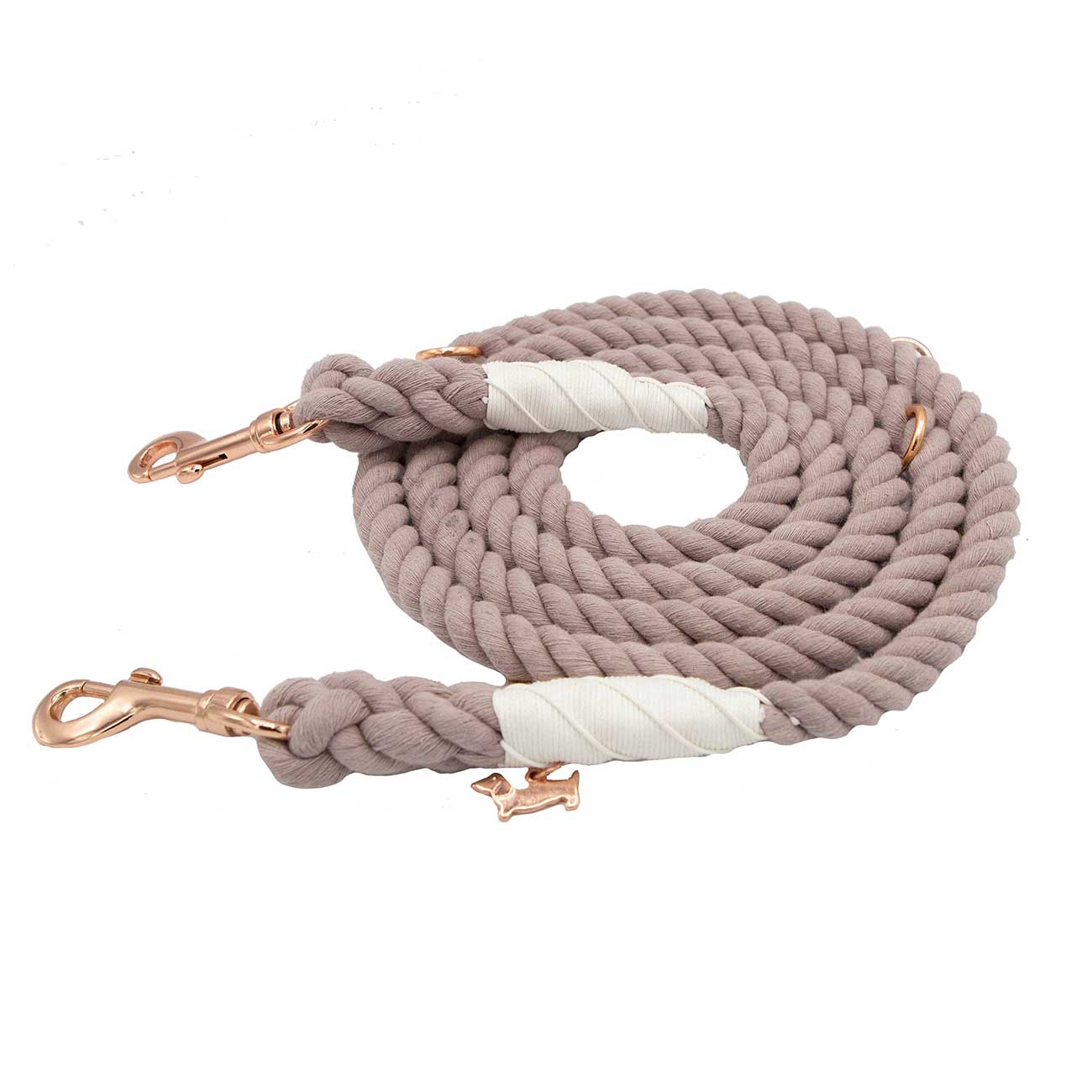 Light brown braided dog leash with rose gold hardware on a white background