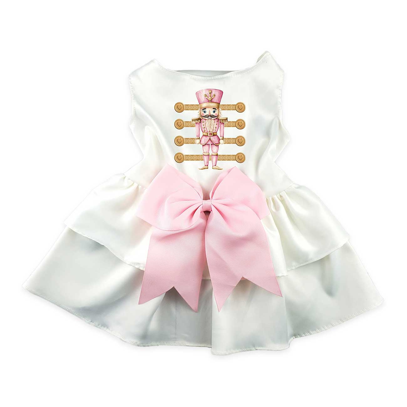 White dog dress with pink bow and cartoon nutcracker on a white background