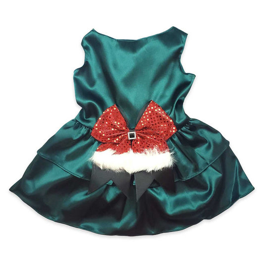 Green satin dog dress with a red bow and white fur trim on a white background