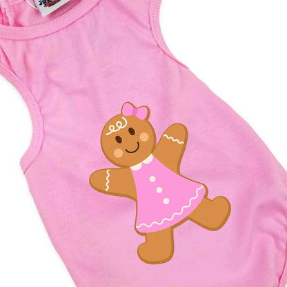 Pink dog top with a gingerbread girl design on a white background