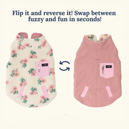 Two reversible dog coats, one floral and one pink striped, with text indicating they can be flipped and swapped.