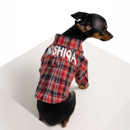 Dog wearing a red plaid shirt with 'MOSHIQA' text on a white background