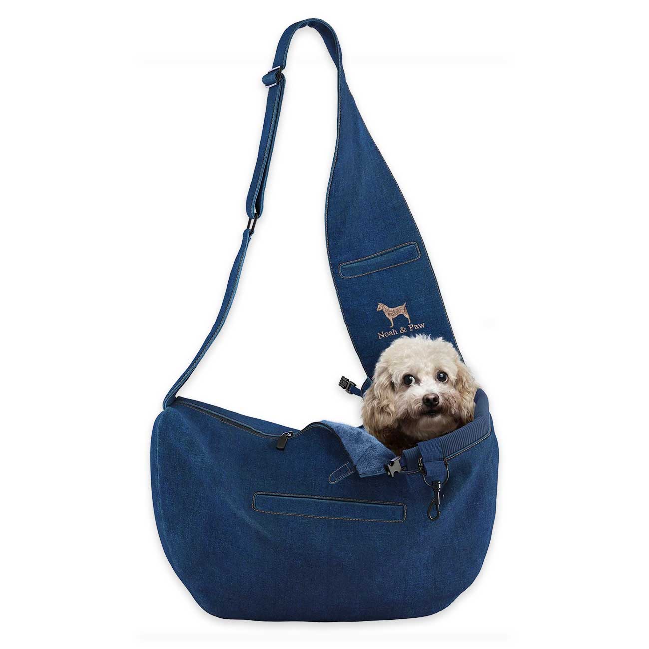 Light Blue denim pet sling with a small dog inside on a white background