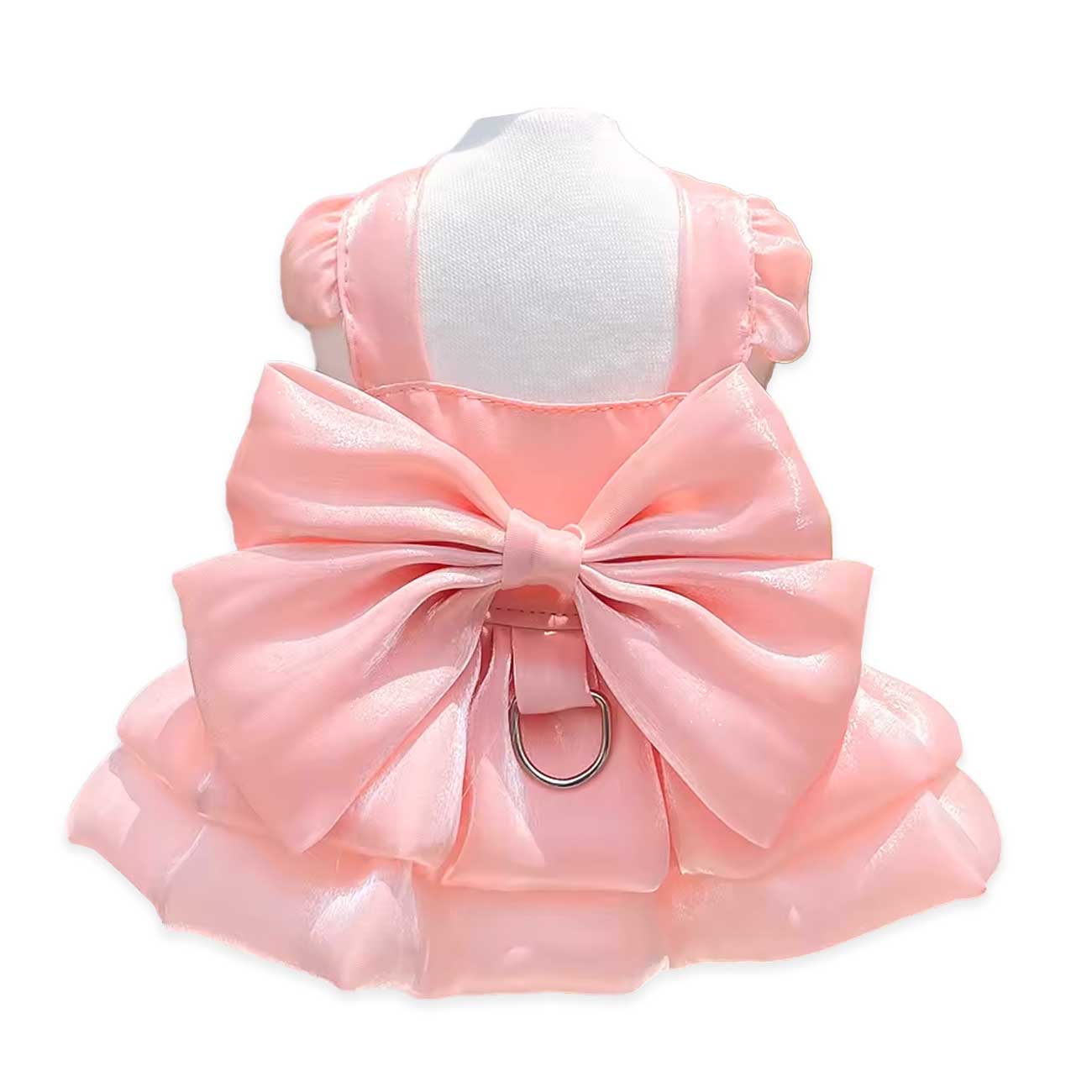 Pink dog dress with a large bow on a white background