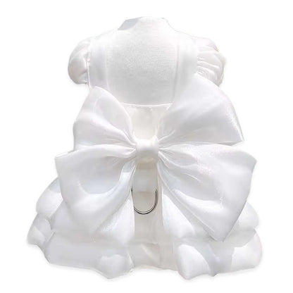 White dog dress with a large bow on a white background