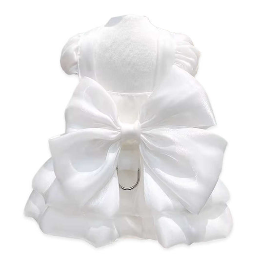 White dog dress with a large bow on a white background