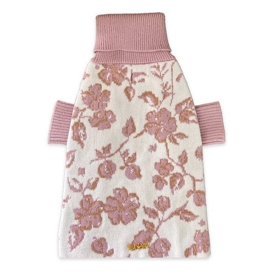Floral patterned dog coat with pink trim on a white background