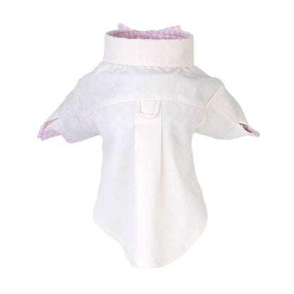 White dog shirt with pink trim on a white background