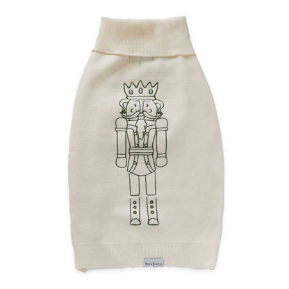 Beige dog sweater with nutcracker design on a white background