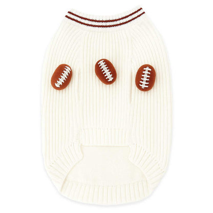 White dog sweater with football patterns on a white background