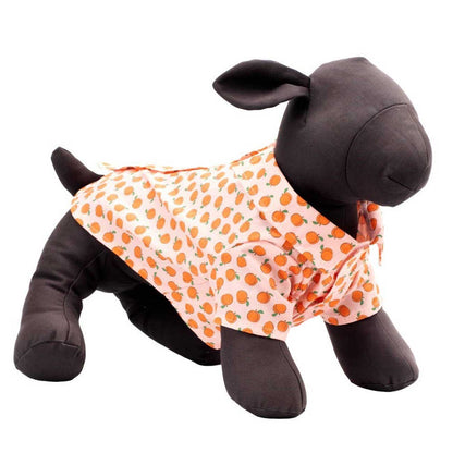 Plush toy sheep wearing an orange polka dot outfit on a white background