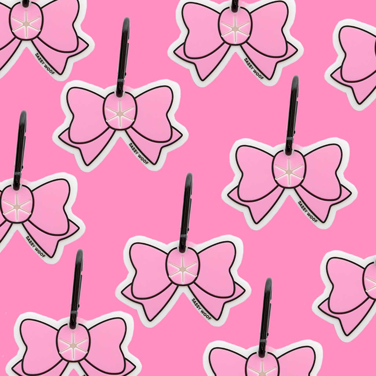 Pattern of pink bow-shaped dog waste bag holder on a pink background