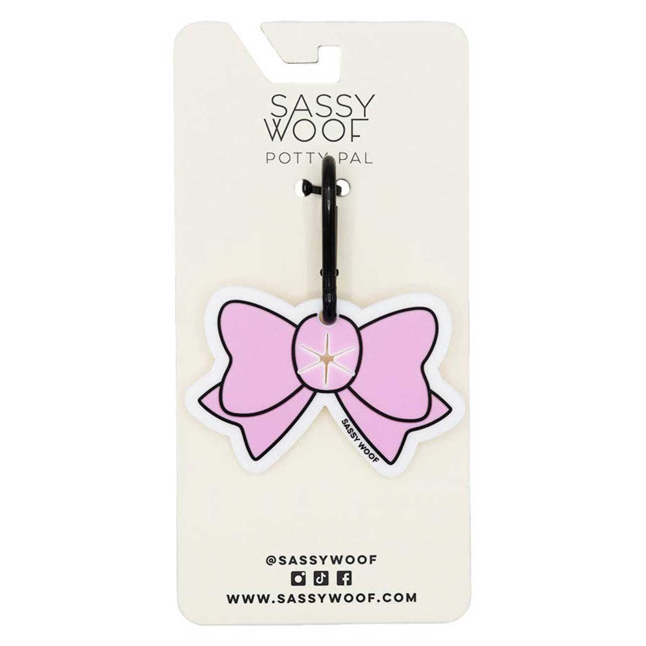 Pink bow design on a Sassy Woof branded card with a black clip.
